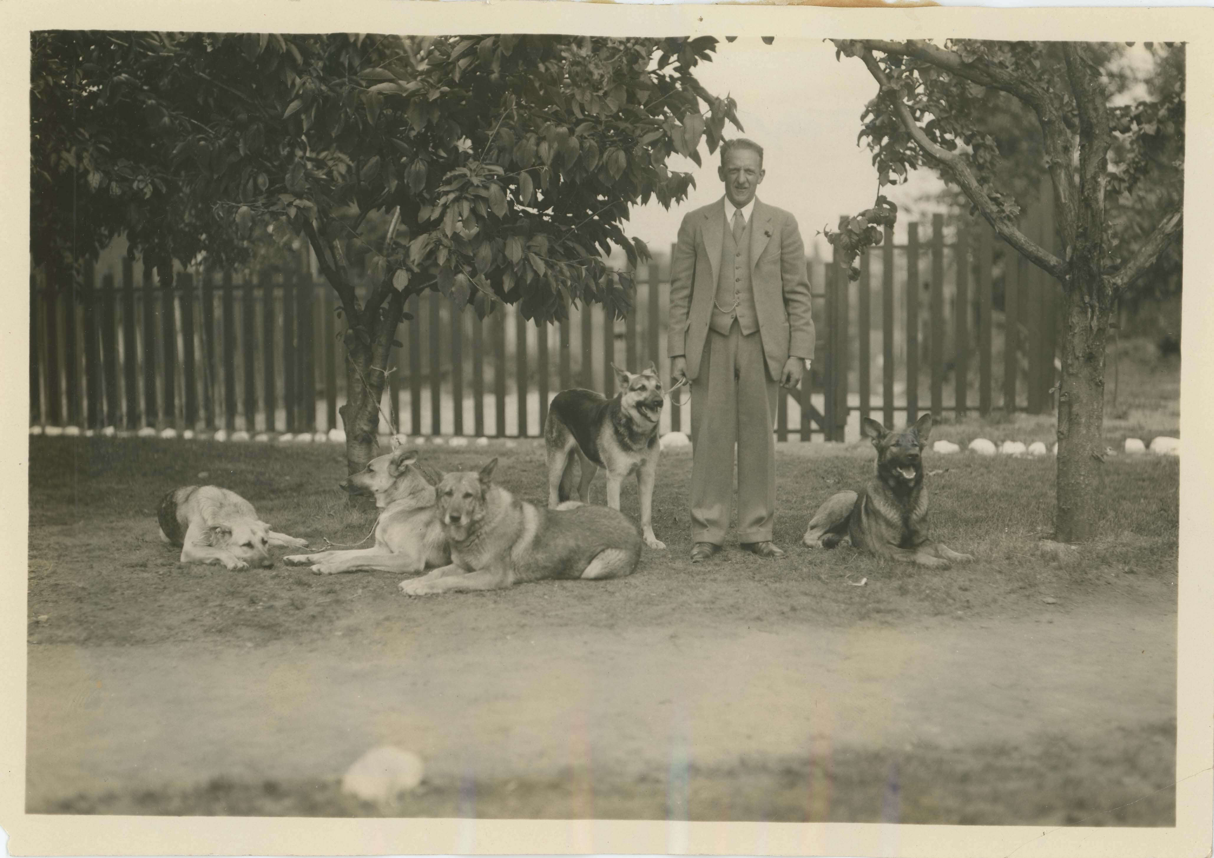 Longstanding headmaster John Harker with his famous campus dogs